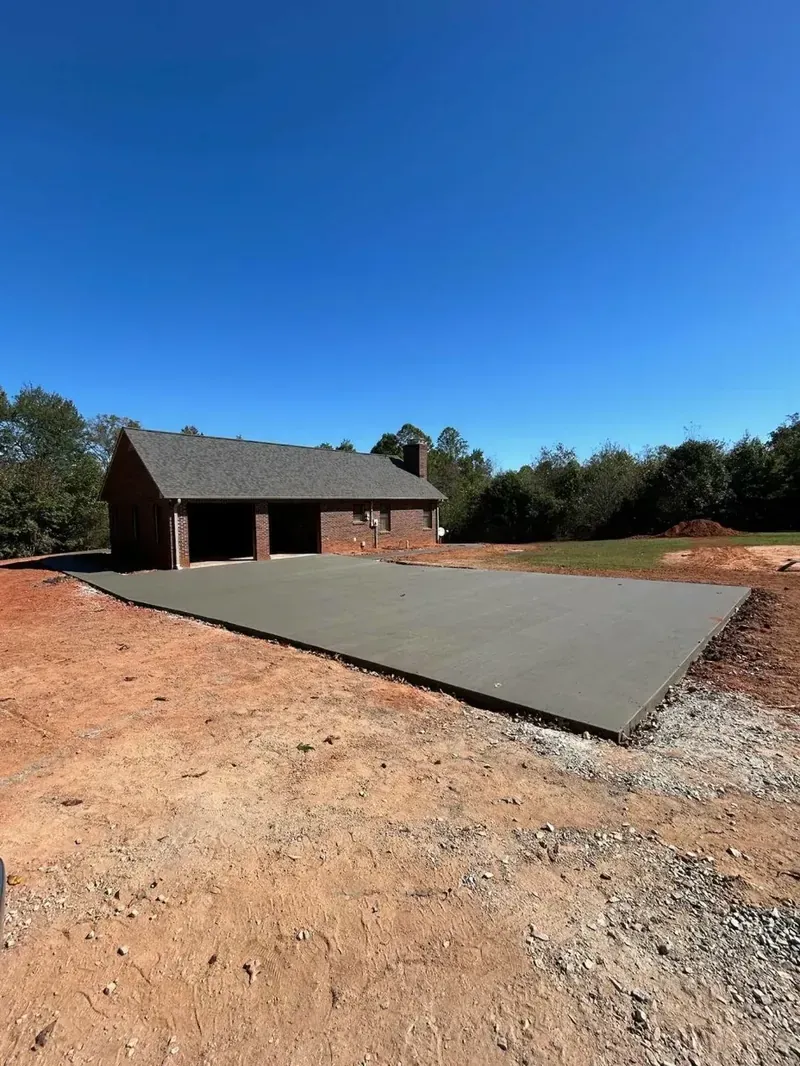 Freshly poured residential concrete slab for a home addition in Denver, NC | Old North Concrete Co.